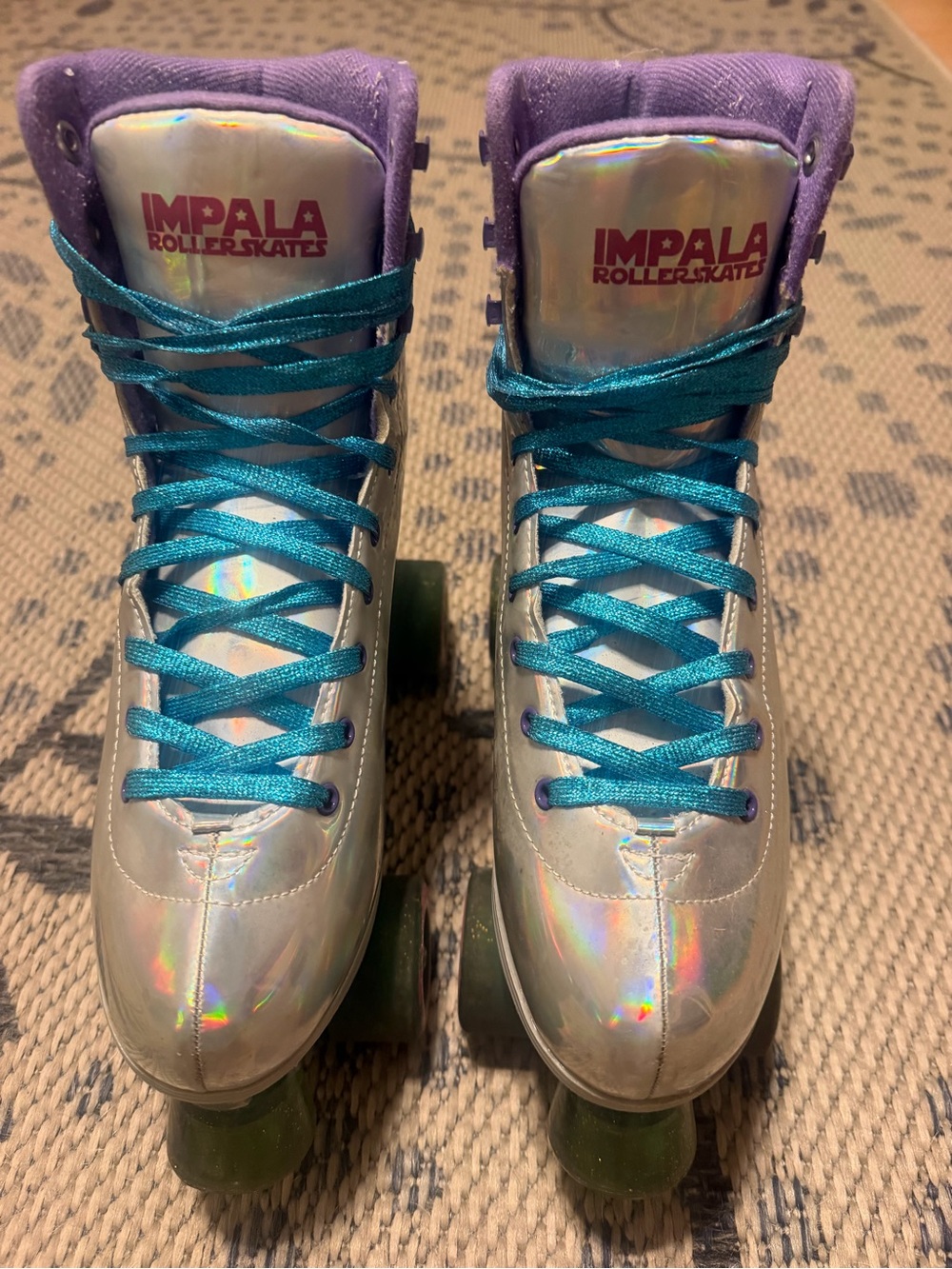 Impala Holographic Quad Roller Skates in Silver with Purple Trim and Teal Laces
